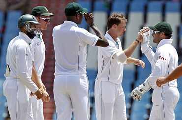 South Africa's Dale Steyn celebrates with team-mates after picking up India's Ishant Sharma duing the first Test in Centurion