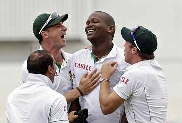 Lonwabo Tsotsobe celebrates after dismissing India's Sachin Tendulkar during the second Test match in Durban