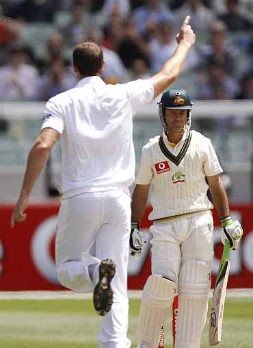 England's Chris Tremlett celebrates after picking up Ricky Ponting during the fourth Ashes Test against Australia in Melbourne