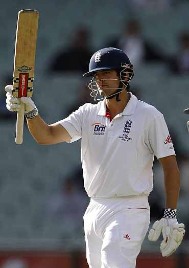 England's Alastair Cook celebrates after making a half-century during the fourth Ashes Test against Australia in Melbourne