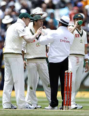Australia's Ponting speaks to umpire Dar after an unsuccessful review during the second day of the fourth Ashes Test against England in Melbourne