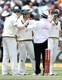 Australia's Ponting speaks to umpire Dar after an unsuccessful review
