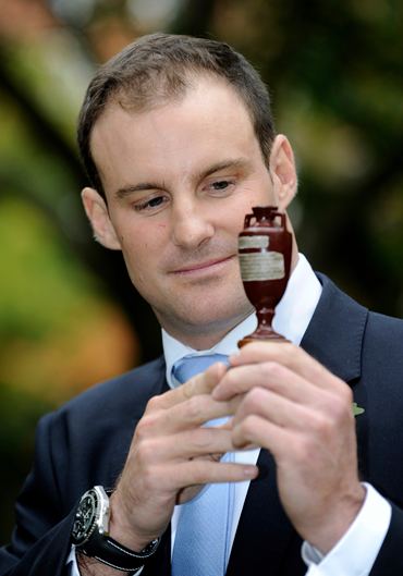 England's Strauss looks at a replica of the Ashes urn at Lord's before the team left for Australia