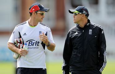Strauss (L) chats with coach Andy Flower before a training session at Lord's