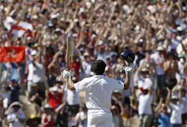 The crowd cheers after Alastair Cook scores a hundred at Adelaide