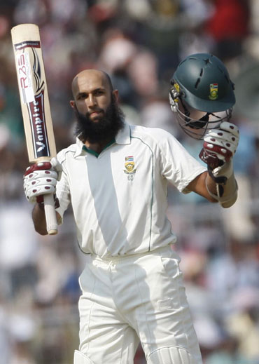 Hashim Amla reacts after he celebrates his century