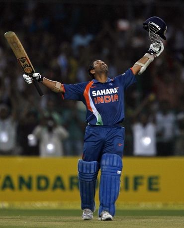 Sachin Tendulkar raises his bat to the stars on completing his double century
