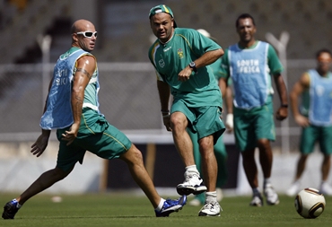 South Africa's Langeveldt and Gibbs play footbal during training