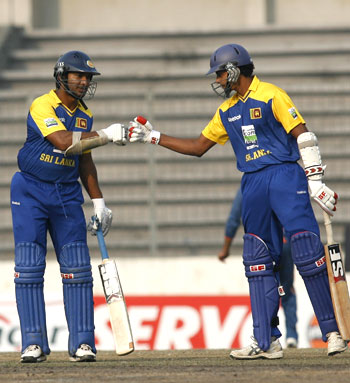 Suraj Randiv (right) congratulates Sangakkara, after the latter scored a half century