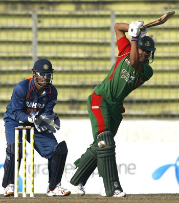 Bangladesh's captain Shakib Al Hasan hits one down the ground