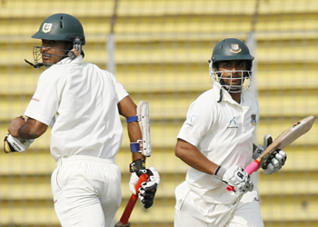 Bangladesh's Junaid Siddique and Tamim Iqbal run between the wickets during their partnership.
