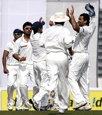 Indian players congratulate Zaheer Khan (right) after he dismissed Raqibul Hasan