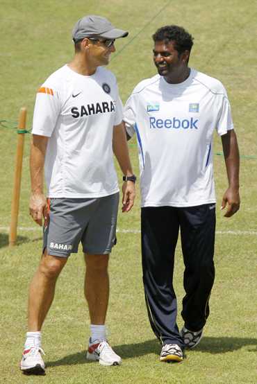 India's coach Gary Kirsten shares a laugh with Sri Lanka's Muttaih Muralitharan during a practice session in Galle