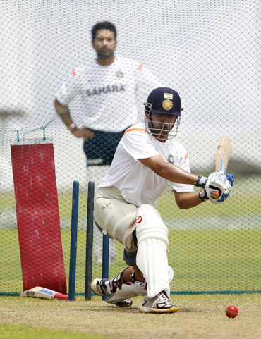 Gautam Gambhir plays a sweep shot during a practice session