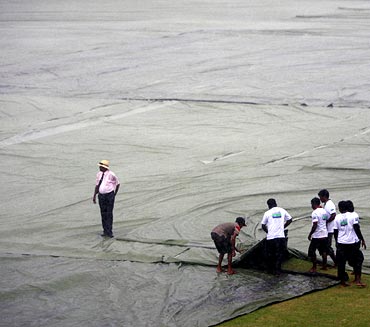 Groundstaff cover the field