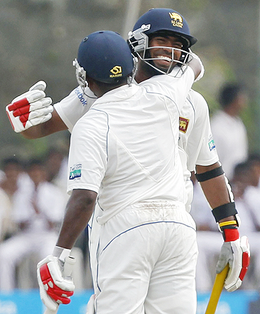 Lasith Malinga celebrates after reaching his half-century