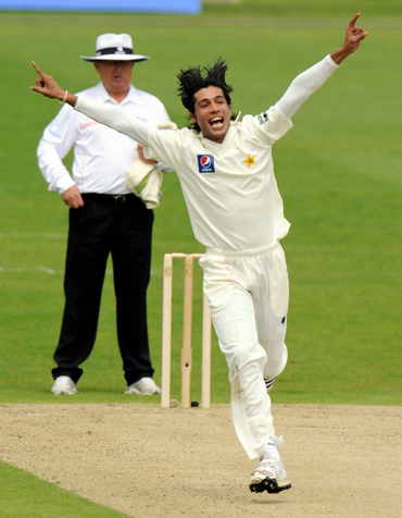 Mohammad Aamer celebrates after picking up a wicket