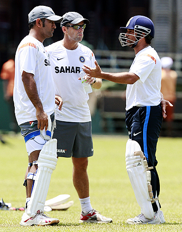 India's captain Mahendra Singh Dhoni, coach Gary Kirsten (centre) and Sachin Tendulkar talk during a practice session in Colombo on Sunday