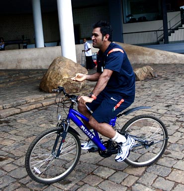 Mahendra Singh Dhoni rides a bicycle in Dambula