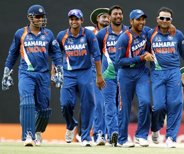 Indian team walk back at the end of the innings
