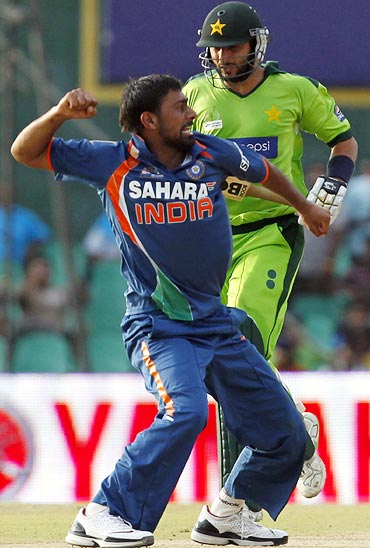 Praveen Kumar celebrates after taking the wicket of Shahid Afridi