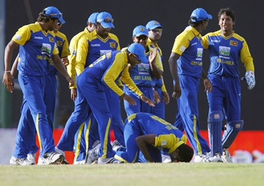 Maharoof kisses the ground after claiming the hat-trick wicket
