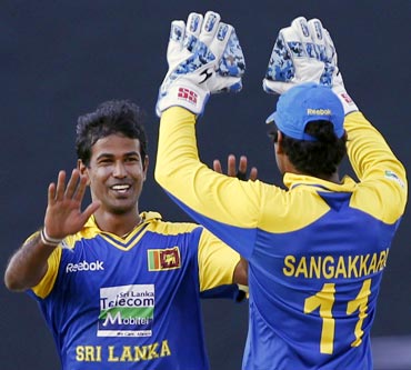 Nuwan Kulasekara (left) and Kumar Sangakkara celebrate the wicket of Rohit Sharma