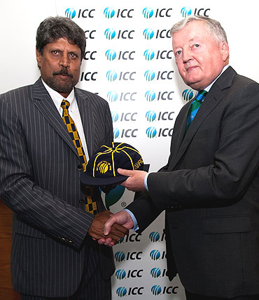 ICC President David Morgan (right) presents Kapil Dev with his commemorative cap during his induction into the ICC Cricket Hall of Fame at the ICC headquarters in Dubai