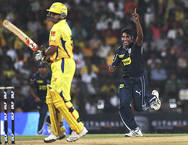Chaminda Vaas celebrates the wicket of Suresh Raina