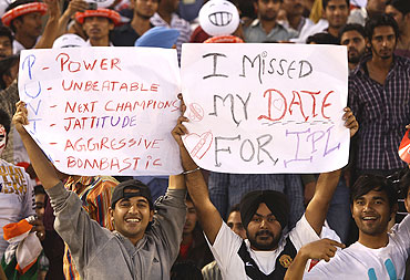 Fans cheer during the match between Kings XI Punjab and the Delhi Daredevils