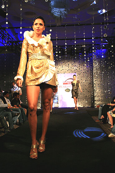 A model walks the runway during the Ramona Narang fashion show