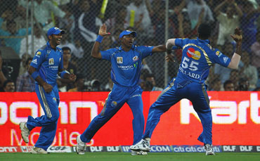 Mumbai Indians players celebrate after a wicket