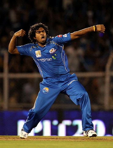 Lasith Malinga celebrates after taking the wicket of Manvinder Bisla