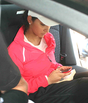 Sania Mirza waits in her car outside the stadium