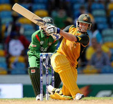 Michael Hussey plays a sweep shot