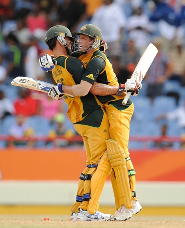 Mike Hussey and Mitchell Johnson celebrate after the winning runs are hit