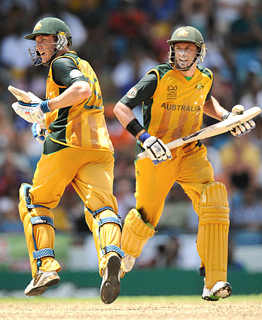 David Hussey (left) and Michael Hussey run between the wickets