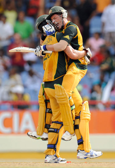 Mike Hussey celebrates after winning the semi-final match against Pakistan