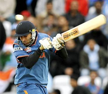 Yuvraj Singh tries to evade a bouncer