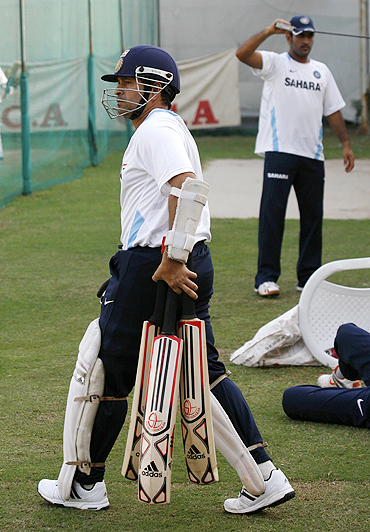 Sachin Tendulkar walks in for some batting practice during a net session in Motera on Monday