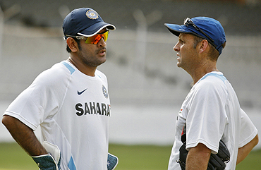 India captain Mahendra Singh Dhoni and coach Gary Kirsten share a thought during a practice session in Motera on Monday