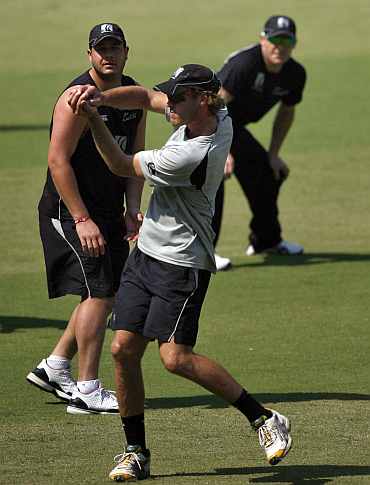 New Zealand's Bradley-John Watling catches the ball as Jesse Ryder and Brendon McCullum watch on