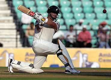 Jesse Ryder plays a sweep shot during the third Test against India in Nagpur