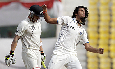 Ishant Sharma celebrates after claiming the wicket of Brendon McCullum