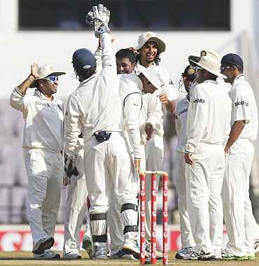 Indian players celebrate after winning the Test match against New Zealand in Nagpur