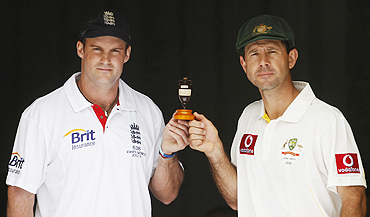 England's captain Andrew Strauss and Australia's captain Ricky Pointing hold the Ashes urn in Brisbane