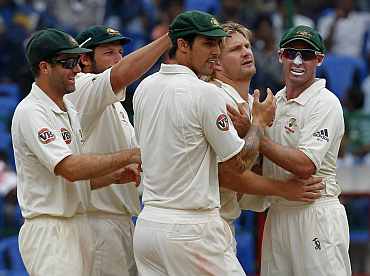 Australian team celebrates after picking up a wicket