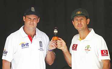 England's captain Andrew Strauss and Australia's captain Ricky Pointing hold the Ashes urn in Brisbane