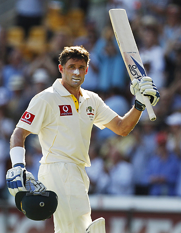 Michael Hussey celebrates after scoring a century on Saturday