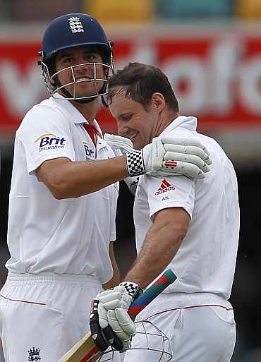 Alastair Cook congratulates Andrew Strauss for his century against Australia during the first Ashes Test in Brisbane